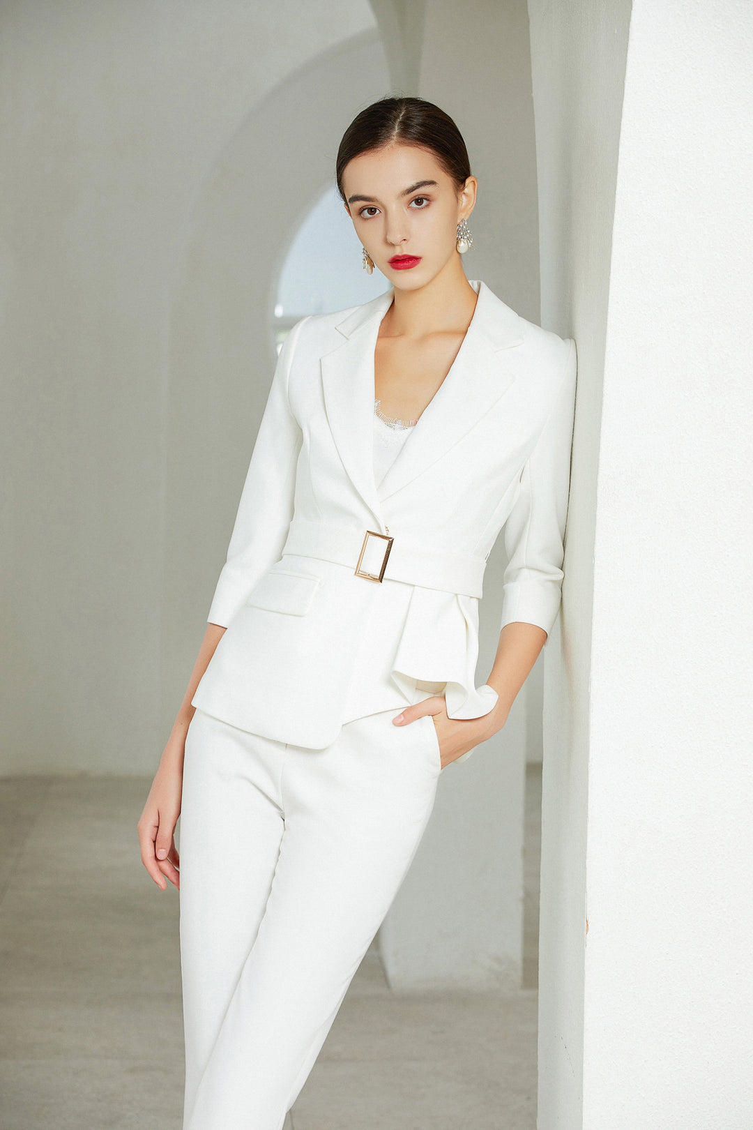 Model wearing Meliora's White Three-Quarter Sleeve Trouser Suit